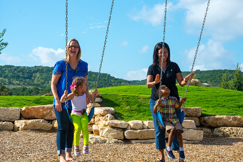 Kids Playing on Swing at Sweetwater Playground