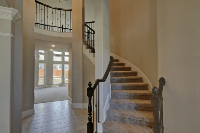Westin’s fully furnished Carter III model in Sweetwater begins with a dramatic rotunda foyer with a spiral staircase