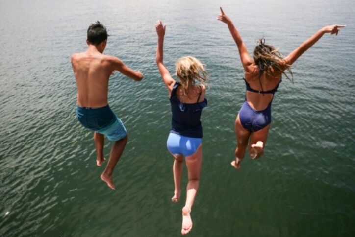 People jumping into Texas lake