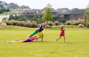 Kids playing outdoors at Sweetwater community Austin, Texas
